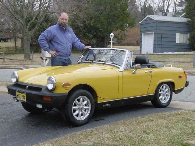 Steve and his 1978 MG Midget in
                2002